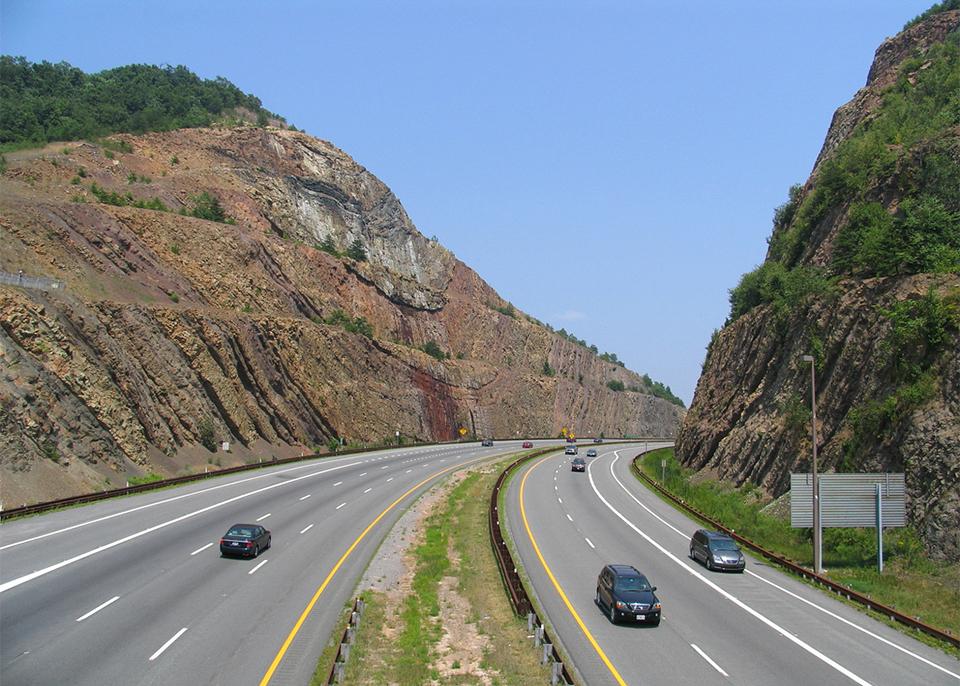 rural interstate cuts through hillside at sideling hill